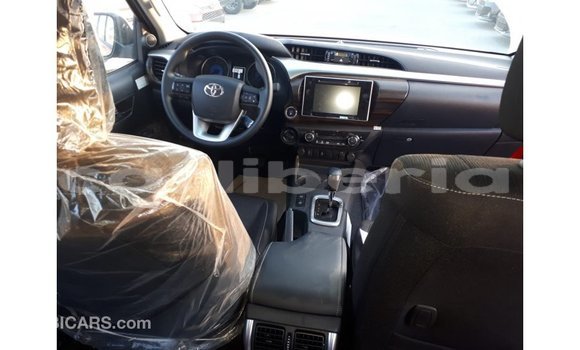 Buy Import Toyota Hilux Red Car in Import - Dubai in Bomi County Buy Import Toyota Hilux Red Car in Import - Dubai in Bomi County