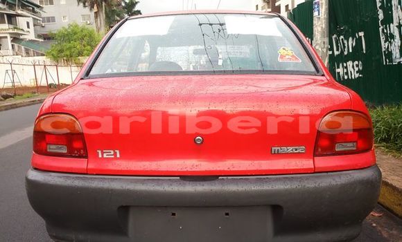 Buy Used Mazda 323 Red Car in Monrovia in Montserrado County